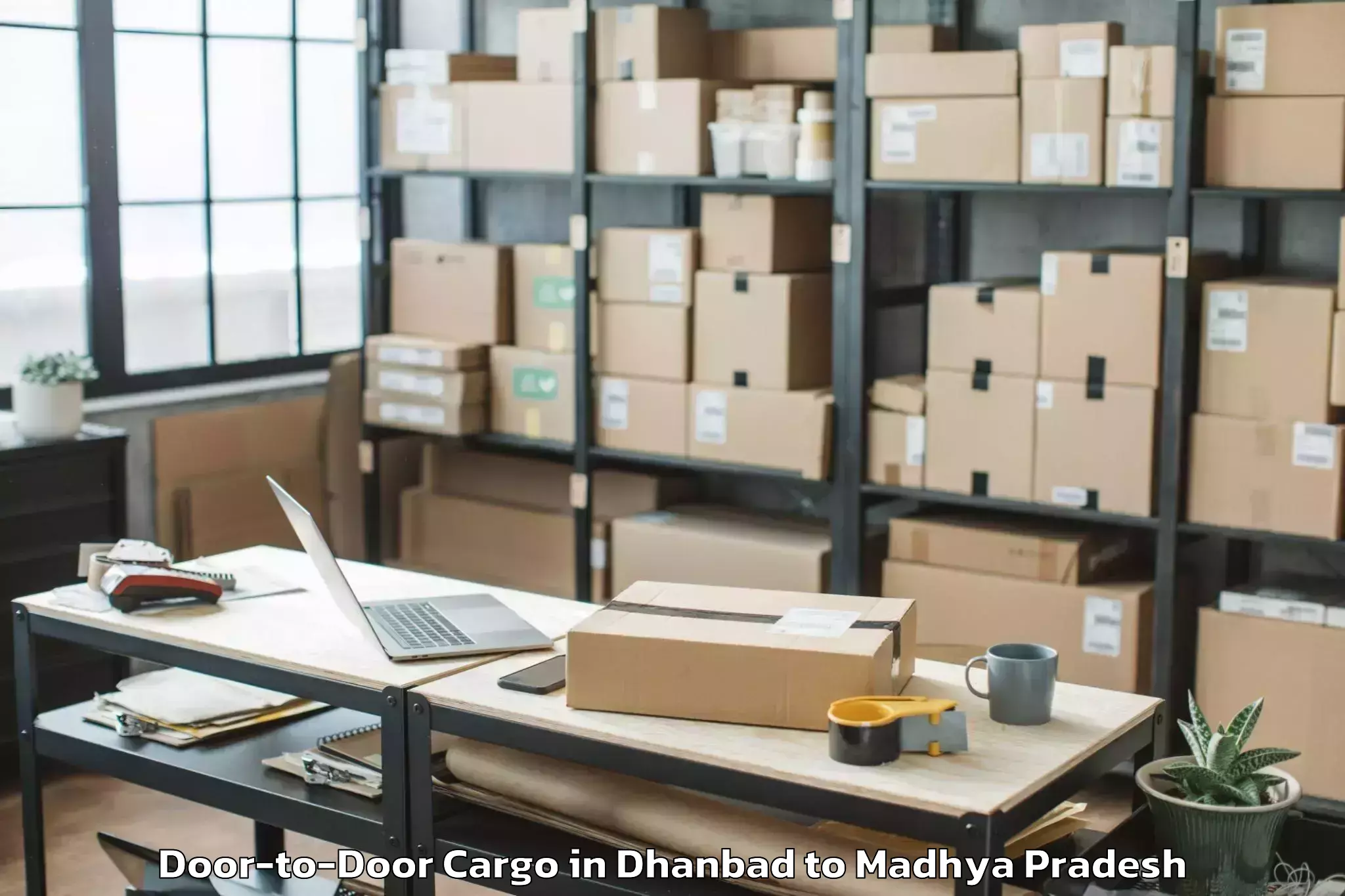 Book Dhanbad to Barnagar Pt Door To Door Cargo Online